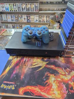 Ps2 console pal version  french one controller cables and 25 games.Language: English, Spanish, French, Portuguese, German