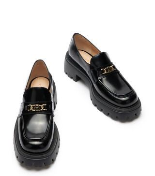 Stuart Weitzman Glossy Black Loafers with Gold Chain