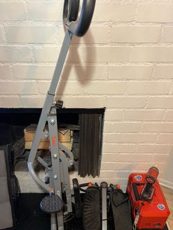 Fold out elliptical machine and foot stepper