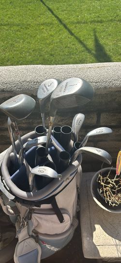 Golf Bag Has Wheels And Girl Clubs