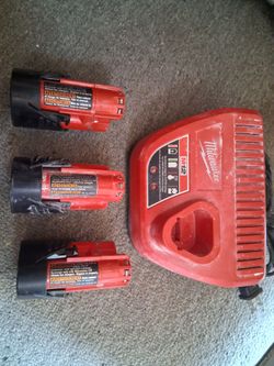 Milwaukee M12 charger with 3 batteries.