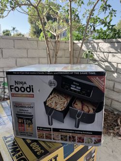 Ninja Foodi DZ201 6-in-1 2-basket air fryer, 8-qt capacity with DualZone technology, Smart Finish, and Match Cook. Box has some shipping damage (torn 