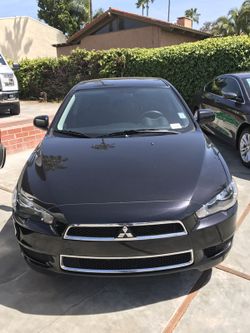2014 mitsubishi black lancer SE. Back up cam. Fully loaded