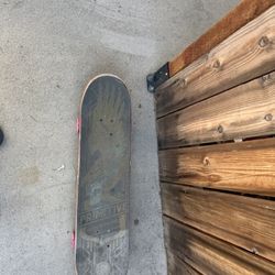 Used Black And Red Skateboard