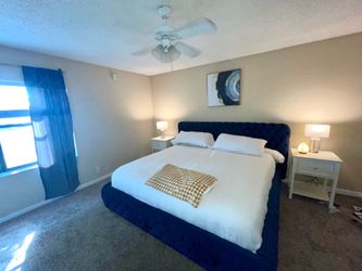 Blue velvet upholstered king size bed frame