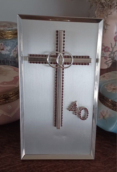 Vintage framed 40th Anniversary Cross w/ruby stones and rings. 