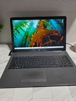 Reliable HP 255 G7 Notebook PC with an AMD A6-9225 Radeon R4 processor. This laptop has 2 cores and runs on Microsoft Windows 11 Pro. It is dark gray 