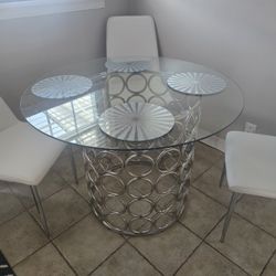 Glass Table With Silver Base And Chairs 