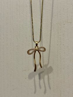 Elegant Gold Tone Bow Pendant Necklace