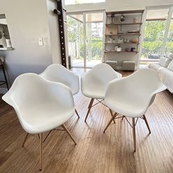 TWO (2) - Alonza Series white chairs with wooden legs. 