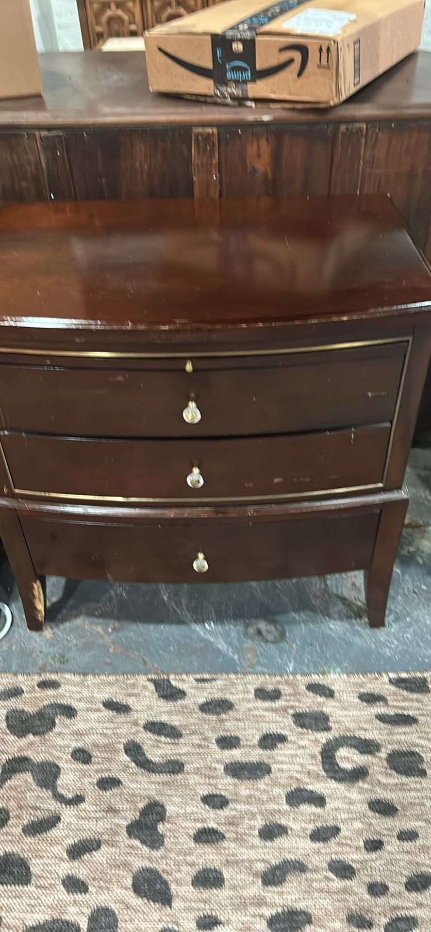 High-end designer nightstand with damaged leg