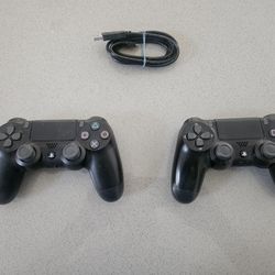 Two Sony Playstation DualShock Wireless Controllers )Model CUH-ZCT2U) & A Charging Cable 