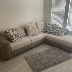 Beige L Shaped Couch And Swivel Chair