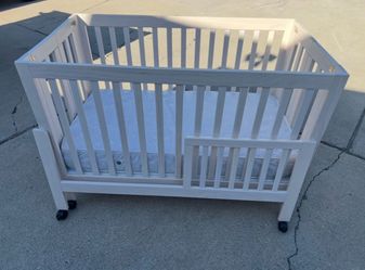 Pottery barn folding crib