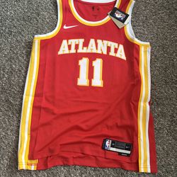 Brand new with tags, Trae Young Hawk’s jersey red men’s size large