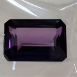 Rare 11.50 Ct Loose Purple Tanzanite Like Zoisite Emerald Cut Stone. This stunning gemstone, with a rare purple hue, is a must-have for any jewelry lo