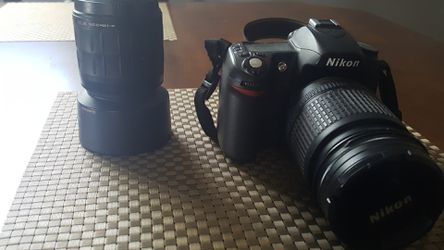 Nikon digital camera. Have charger and wide angle lens...other Lens needs repair doesnt lock