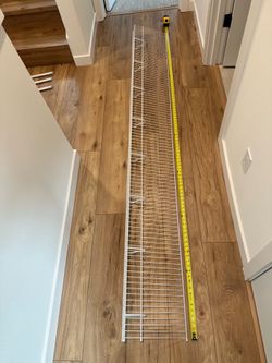 White wire shelves with closetmaid mounting accessories.