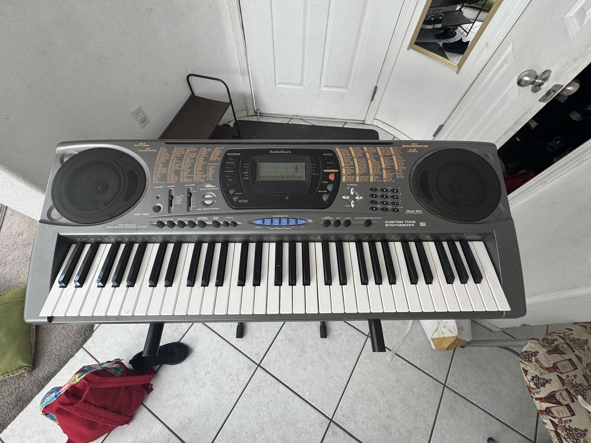 RadioShack MD-1121 electronic keyboard, also known as a MIDI synthesizer With Holder For ($65)