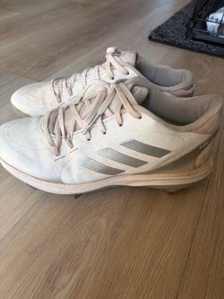 White metal Adidas softball cleats