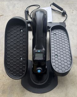 The UKEEP mini elliptical cross trainer (Model UK-3613) is a compact, under-desk exercise machine for low-impact cardio, featuring manual resistance w