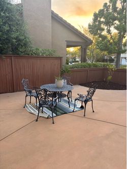 Black wrought iron table and chairs