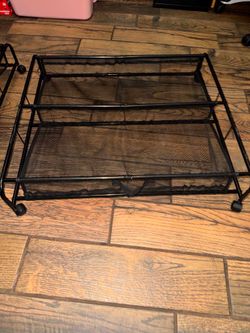 black metal rolling under-bed shoe storage rack
