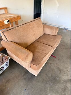 Love seat: there are green marks from a marker on the arm rests.