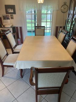 Dining room table with leaf six chairs four covers