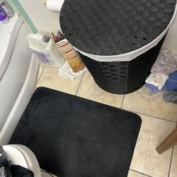 Black Woven Laundry Hamper With Black Rug