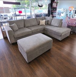 Grey corduroy 3-pc sectional sofa with storage ottoman  New in box