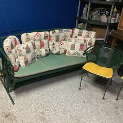 Vintage wrought iron set including four chairs, table, rocking glider full couch with all cushions All in very good condition kept and used in an indo