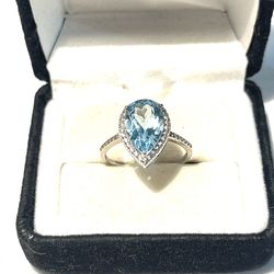 Brand new .925 silver ring with pear shaped aquamarine. Size 7.