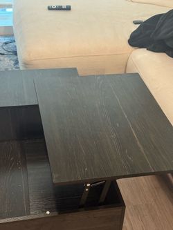 Black wood artisanal coffee table with storage inside
