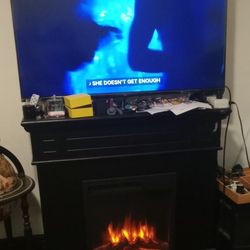 55 Inch TV..and FIREPLACE must Go