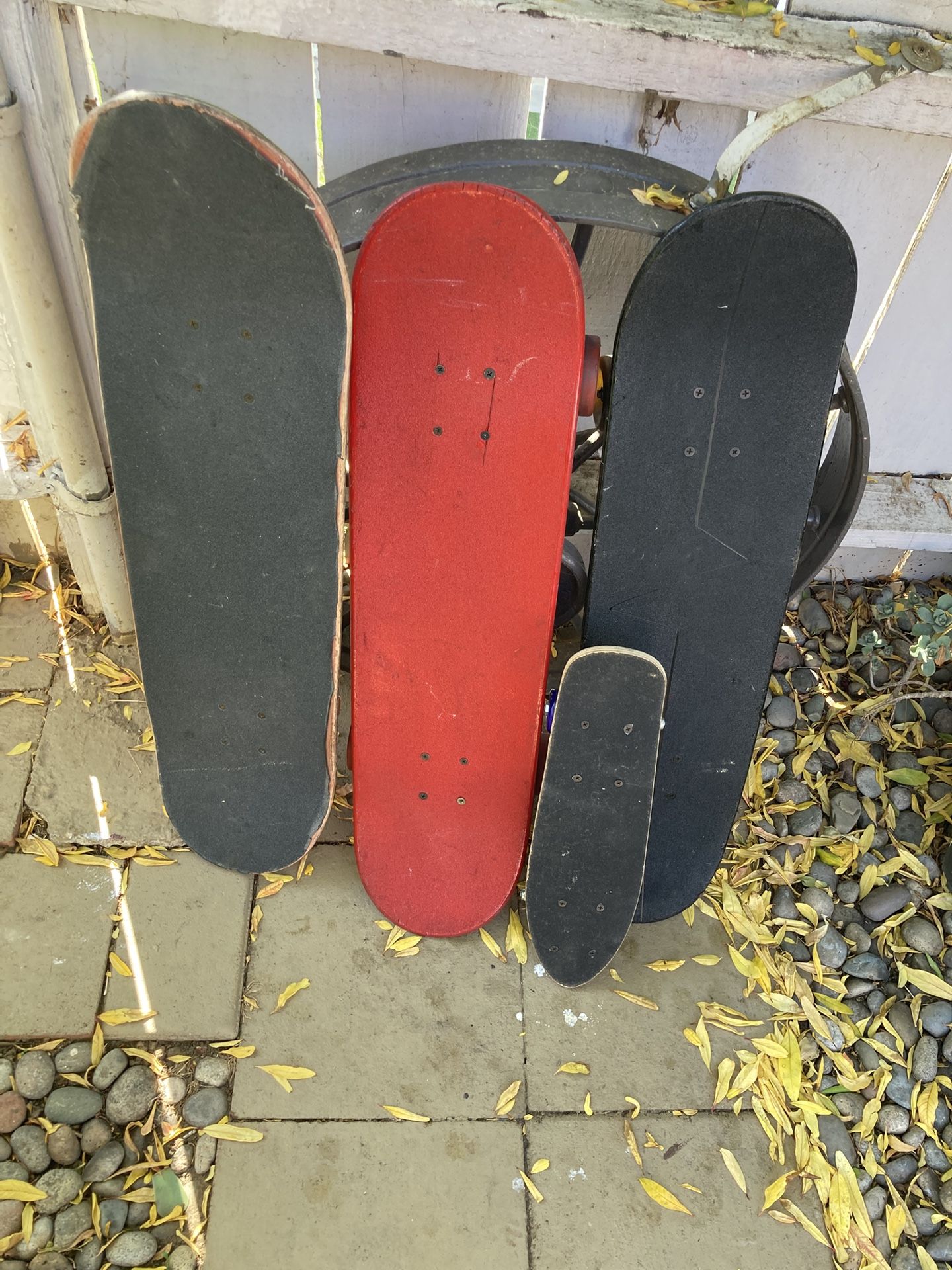 Skateboards red board $30 blackboard 25 orange board 15 small board five dollars