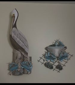 Pelican and blue crab pot