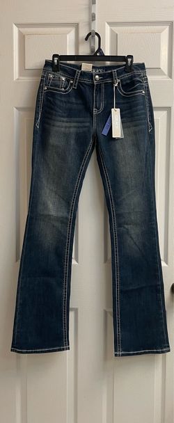 Brand new Juniors dark wash jeans with details on back pockets size 28