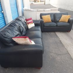 Really leather couch and loveseat black,