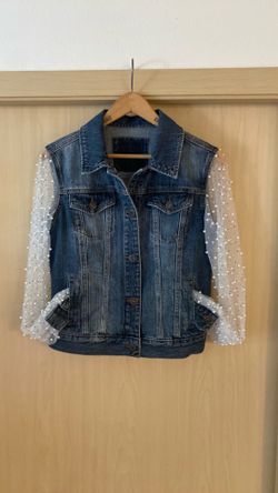 Jean jacket with bejeweled sleeves and back.