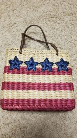 Small sturdy straw purse with zipper closure on top