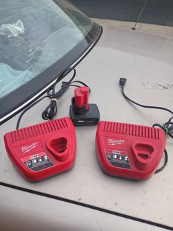 Milwaukee battery chargers and a battery