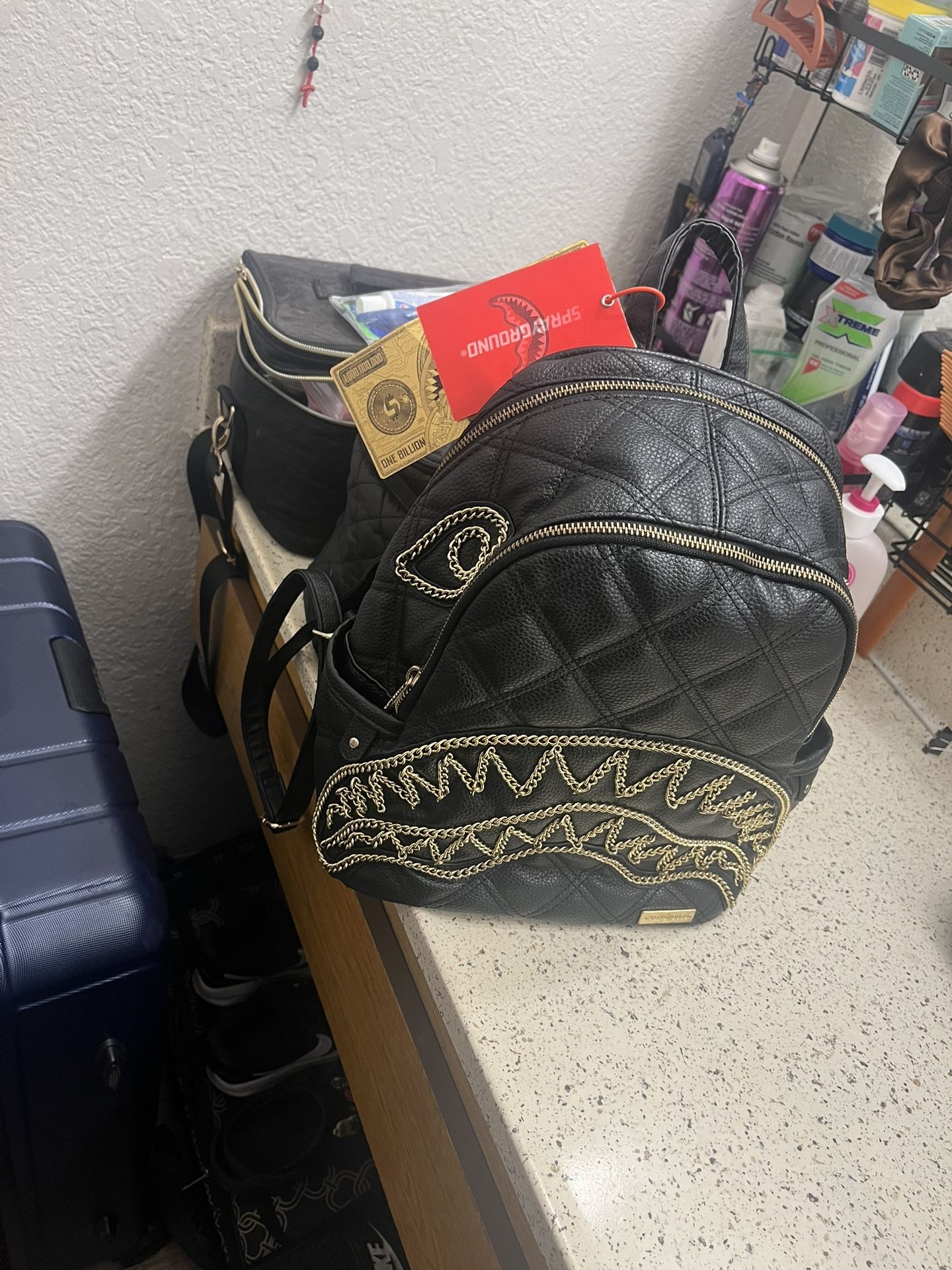 NOIR QUILT GOLD CHAIN SPRAYGROUND TRADES