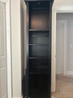 Tall Dark Wood Bookcase with Multiple Shelves