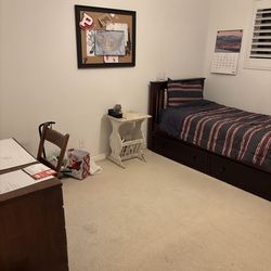 Maple twin bed with sliding drawers