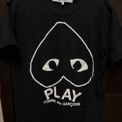 Comme de garçon black t shirt, fits between small to medium, women’s  or small men’s 