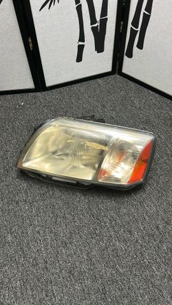 2004 - 2008 Mitsubishi Endeavor Left Headlight  Driver Side  OEM 