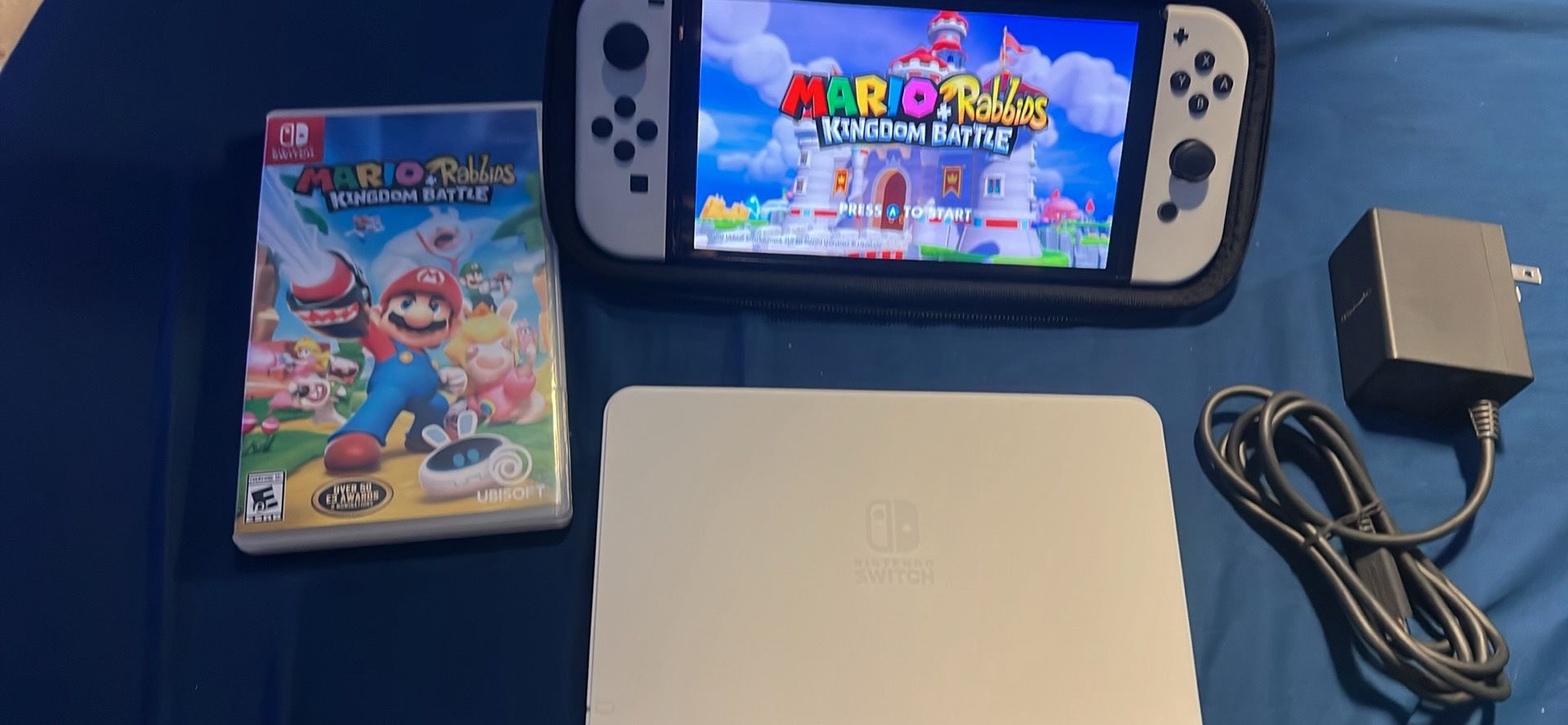 Nintendo switch OLED with docking station, and Mario and rabbids kingdom battle game 