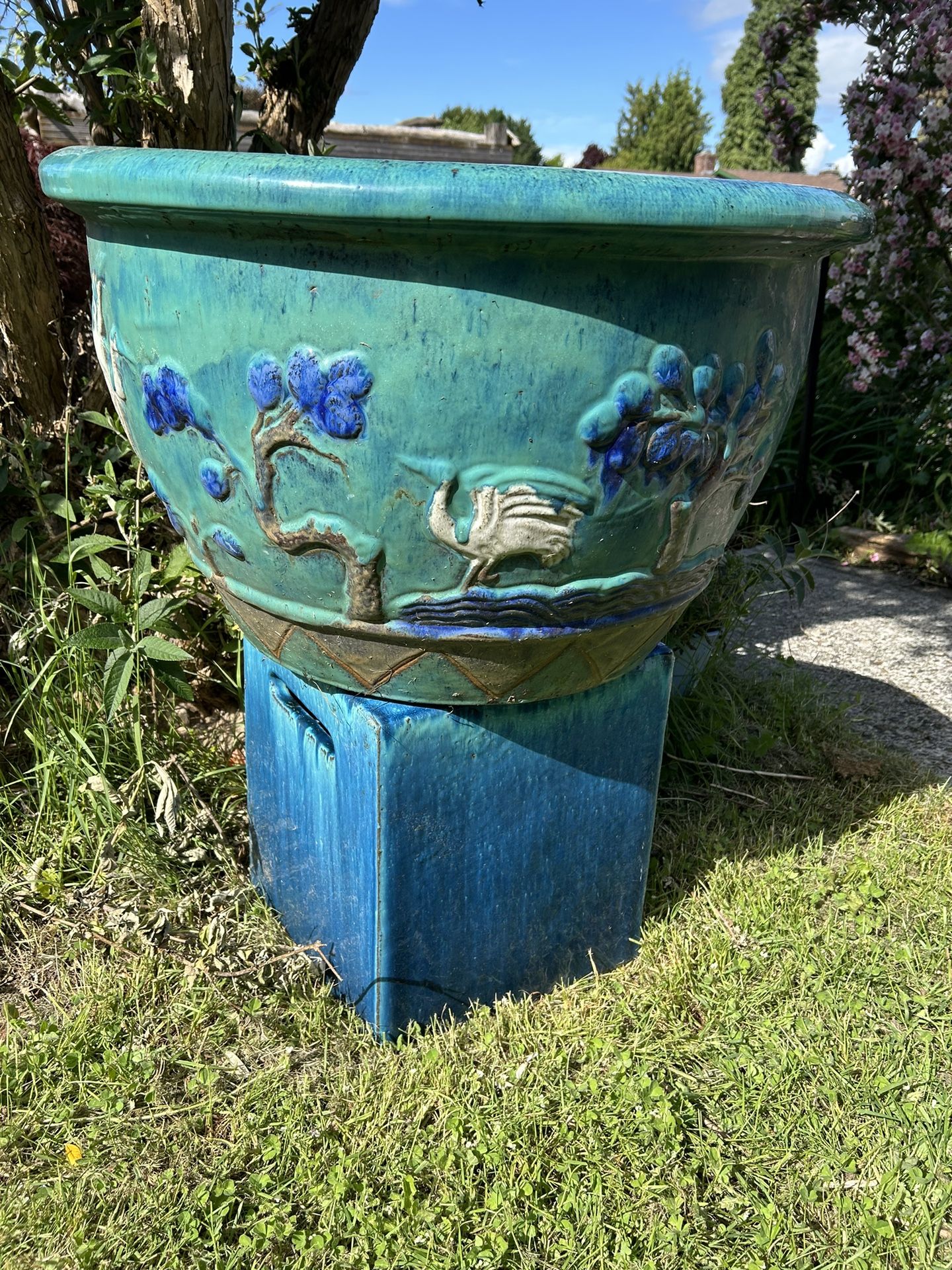 Very large porcelain planter w/Asian theme. Nicely glazed. Includes pedestal also nicely glazed.  Picked up an estate sale.  28 inches in diameter 