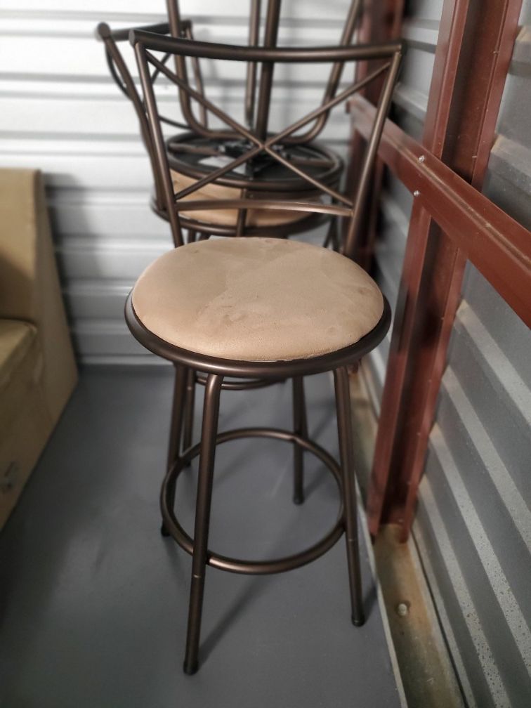 3 brown/tan bar stools